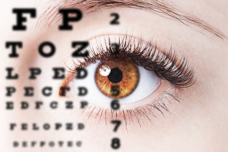 Close up of a woman's eye with a brown pupil and an eye test overlay